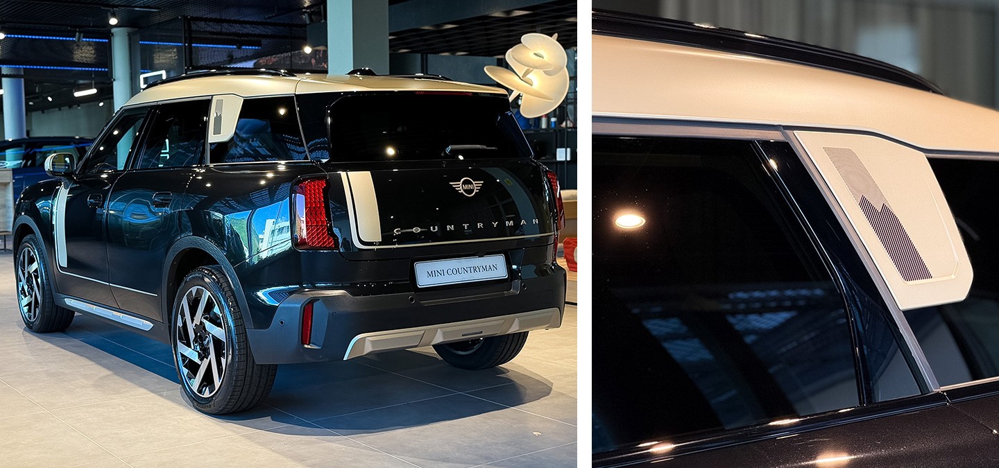 Front side view of the MINI Countryman in Midnight Black and Vibrant Silver roof parking.